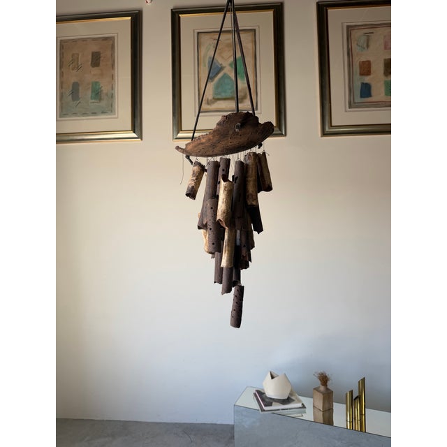 A striking vintage studio pottery wind chime featuring an organic, sculptural composition. Hand-formed ceramic tubes in...