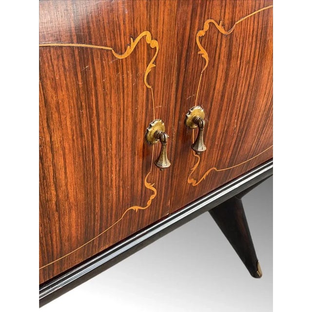 A pair of mid-20th century circa. 1950's italian bedside cabinets in the manner of paolo buffa. each having glass insert...