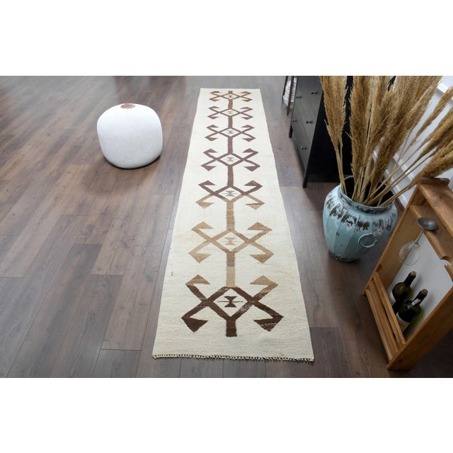 Vintage Persian Hand-Knotted runner rug is a semi-antique vintage runner rug. The '70s Eastern region of Anatolian's...