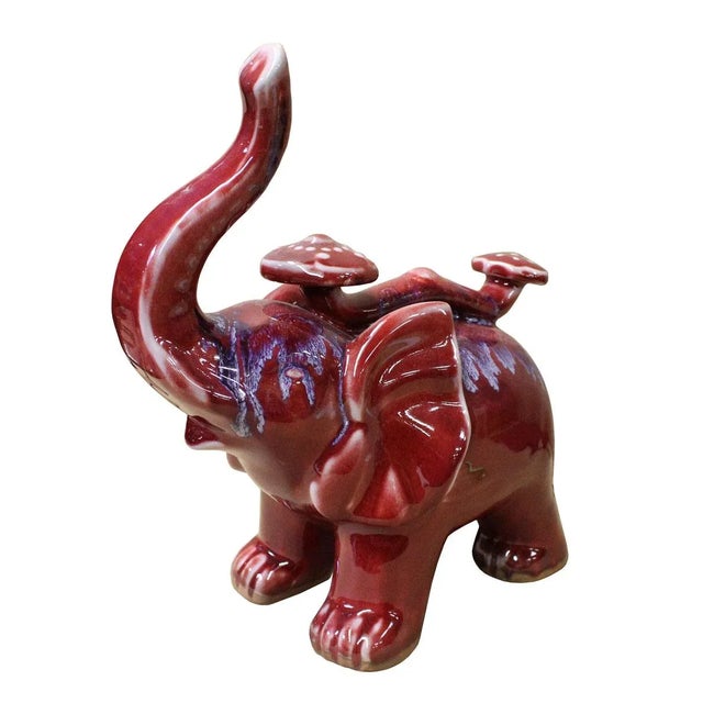 This is a handmade trunk up Chinese accent decorative elephant with Ru Yi figure made of ceramic and glazed with modern...