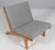 Hans j. Wegner lounge chair with loose cushions new upholstered with light grey wool. Frame of solid soap treated oak...