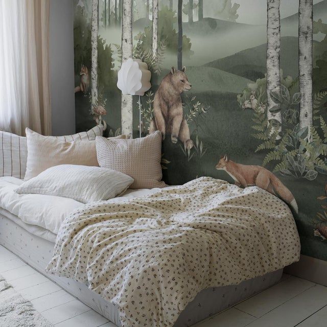Conjuring a misty landscape of ferns and birch trees inhabited by charming woodland animals, Boråstapeter’s Wild Forest...
