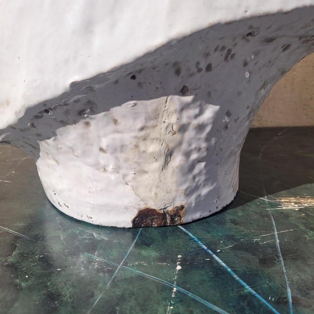 Two large ceramic horse heads with a glossy white glaze, inspired by the "Horses of Saint Mark" or the so-called Protome...