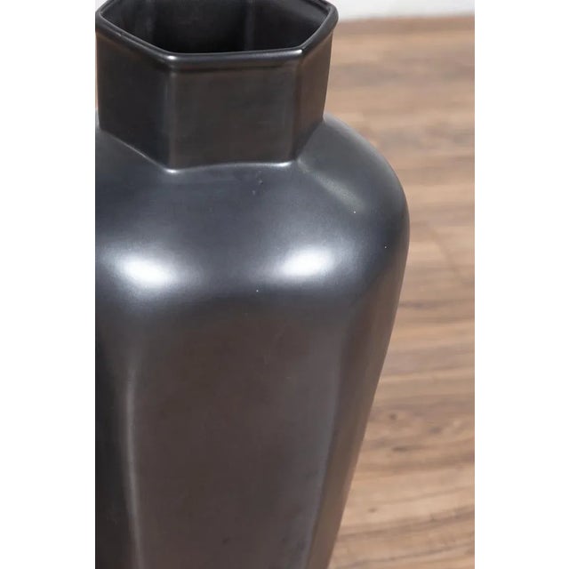 A pair of Chinese contemporary matte cobalt grey glazed ceramic vases with tapering bodies and hexagonal necks. Charming...