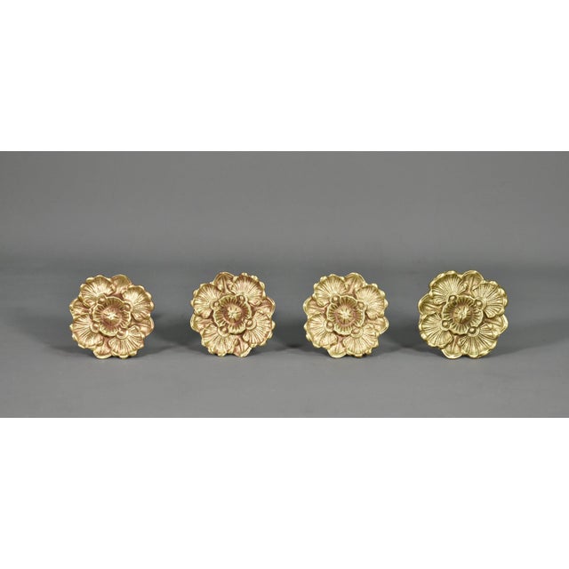 This elegant set of four matching French antique bronze curtain tie-backs dates to the early 20th century and was sourced...