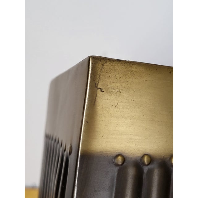 This item is heavy brass. Great for a MCM or hollywood regency style decor.