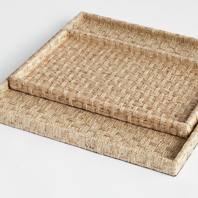 Intentionally designed as shallow nesting trays, this pair was created for versatility. Made of Mendong, a fresh water...