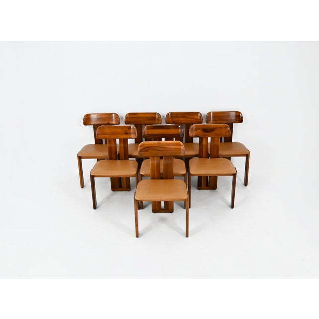 Set of 8 Mario Marenco brown wood and leather chairs. Model: Sapporo. Seat height: 47 cm. Wear consistent with age and...