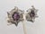 1950s silvertone filigree flowers with prong set round faux-amethyst centers clip earrings. Marked "NAPIER PAT. PEND."...