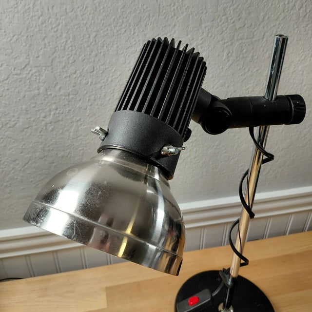 Classic vintage industrial desk lamp featuring a fully articulating design and durable metal construction. Combining...