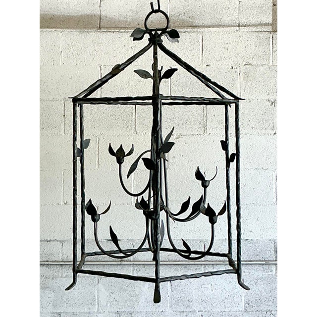 Discover the dramatic elegance of this vintage candle lantern, a substantial and sculptural piece crafted from hand-forged...