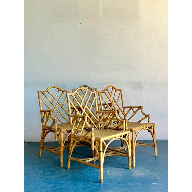 Command attention and exude timeless sophistication with this exceptional set of four vintage Chinese Chippendale dining...