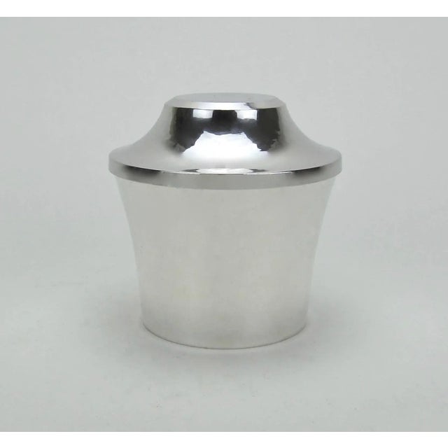 A sleek sterling silver covered box from the Art Deco period by Marie Zimmermann (1879-1972), a noted American...