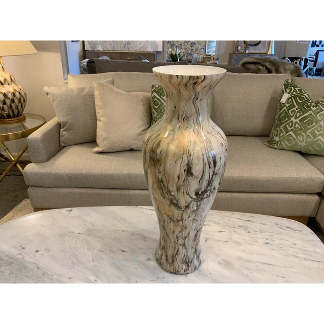 Be mesmerized by the swirls of the calacatta gold... Cream, gray and gold create a marbled pattern on this striking 20"...