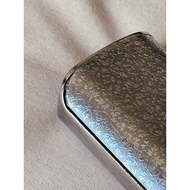A charming vintage French silent butler (crumb catcher), distinguished by its softly sculpted form and intricate metalwork...