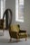 A charming pair of Danish lounge chairs crafted in solid oak and upholstered in their original green fabric with...