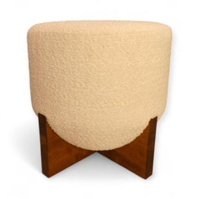 Pair of cylindrical poufs upholstered in off-white bouclé fabric. Italian in origin, crafted in the mid-20th century from...