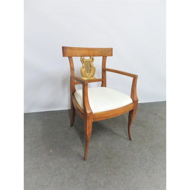 Beidermier style arm chair, maple frame with swan carved gold gilt back, white leather upholstered seat.
