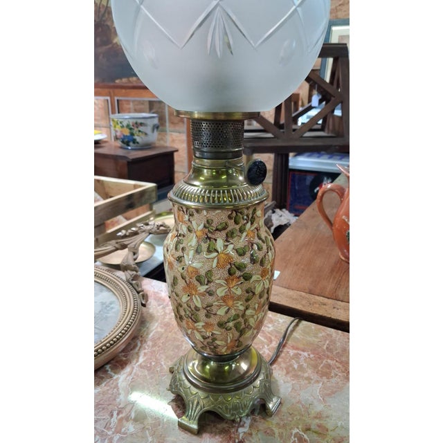 Art Nouveau Oil Lamp in Glazed Earthenware with Floral Relief Decoration on Gilt Bronze Base, 1890s, in Good conditions....