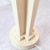 A bold postmodern table lamp in a soft cream finish, built around an architectural column form with a dramatic sphere...