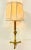 Brass French table lamp from the 1950s in a graceful design on a tripod-shaped base. Very nice and stylish designed and...