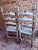 White Pair of Early 20th Century Rush Seat Ladderback Side Chairs With Distressed White Chippy Paint Finish For Sale - Image 8 of 12