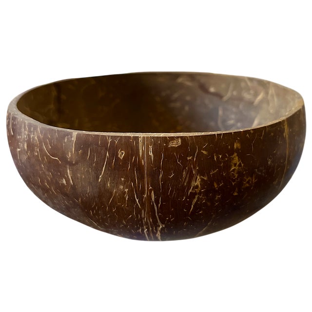 A beautifully simple, naturally sculptural bowl carved from a single coconut shell. The rich espresso-brown exterior is...