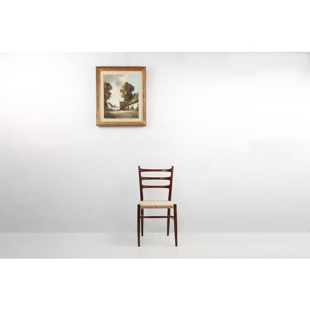 This evocative oil on canvas by Jos Pauwels captures the tranquil rhythm of rural Belgium in the mid‑20th century. A...