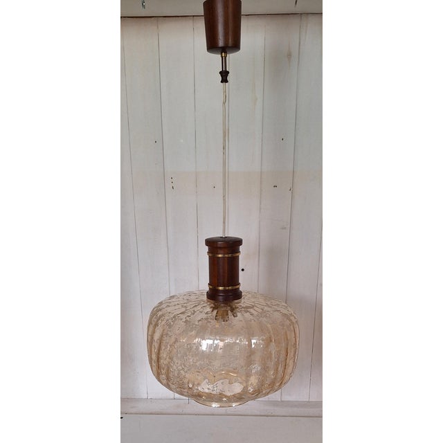 Vintage Ceiling Lamp with Amber-Tinted Glass Shade on Mahogany and Brass Mount, 1980s, in Very Good conditions. Designed...