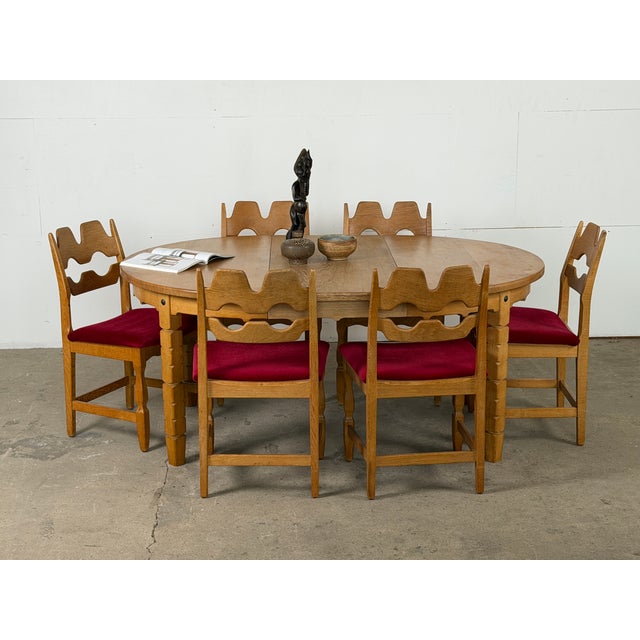 Danish set of six Razorblade dining chairs in solid oak, designed by Henning Kjærnulf for Nyrup Møbelfabrik, 1960s. The...