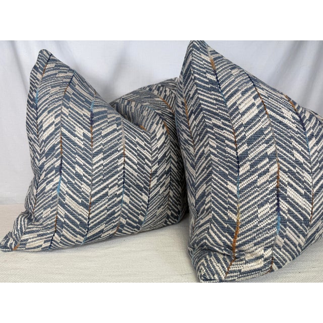 Custom pair of 22" pillows covered in Osborne & Little "Elgin" in color blue. These pillows have tapered corners to...
