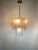 Elegant vintage chandelier designed by Zero Quattro for Fontana Arte, handmade in Italy in the 1960s. The piece consists...