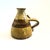 A vintage hand made studio pottery vase. Finished in lovely earth tone glazes and with a handle formed on one side. Signed...