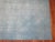 Square size hand-knotted Turkish Kilim in a blotchy aqua blue color. Handwoven by recycled cotton and goat hair material...