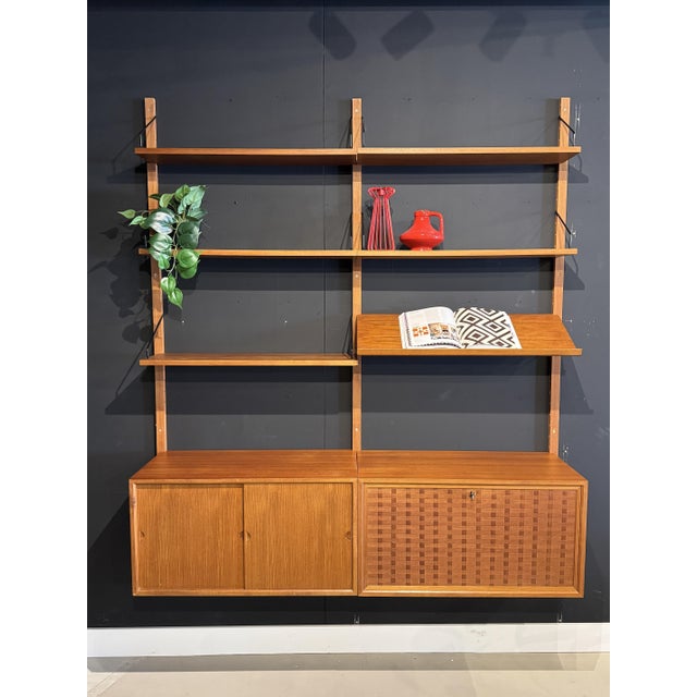 A stunning vintage royal system wall unit by poul cadovius, one of the most iconic modular wall units in the history of...
