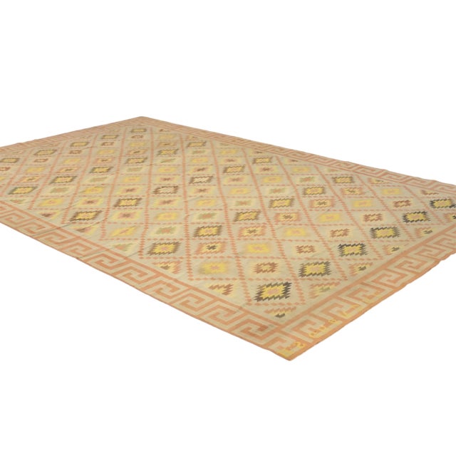 This vintage 11x18 Dhurrie flat weave runner is an exciting new entry in Rug & Kilim’s esteemed collection. Handwoven in...