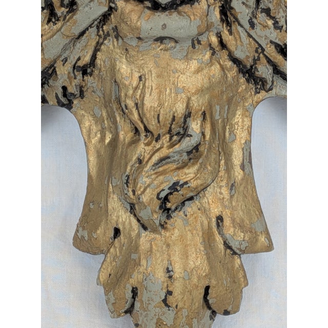 Late 19th-century wooden ornament from a bourgeois house, depicting a satyr's head. The wood is painted gold. Two available.