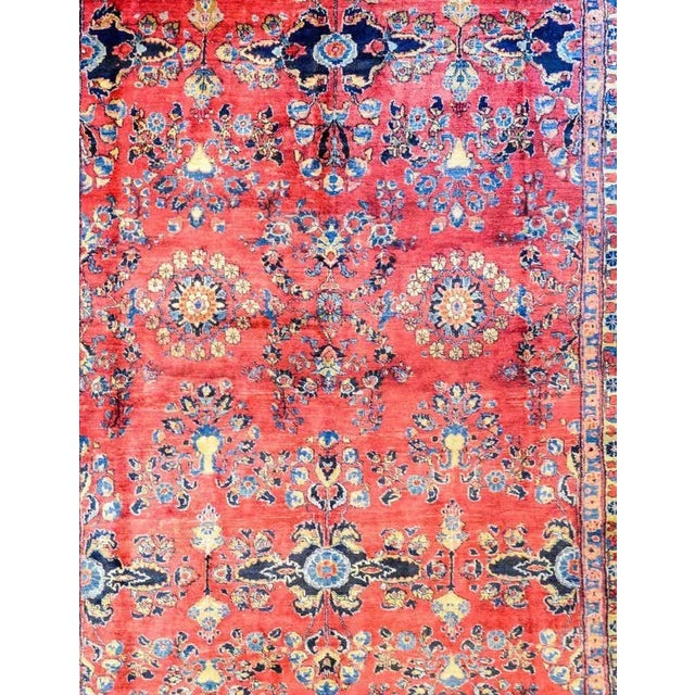 An exceptional early 20th century Lilihan rug with a traditional mirrored floral pattern woven in light and dark indigo...
