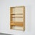 A wall-mounted display cabinet in solid pine, designed by Charlotte Perriand to complement the wall units in the Pierre...