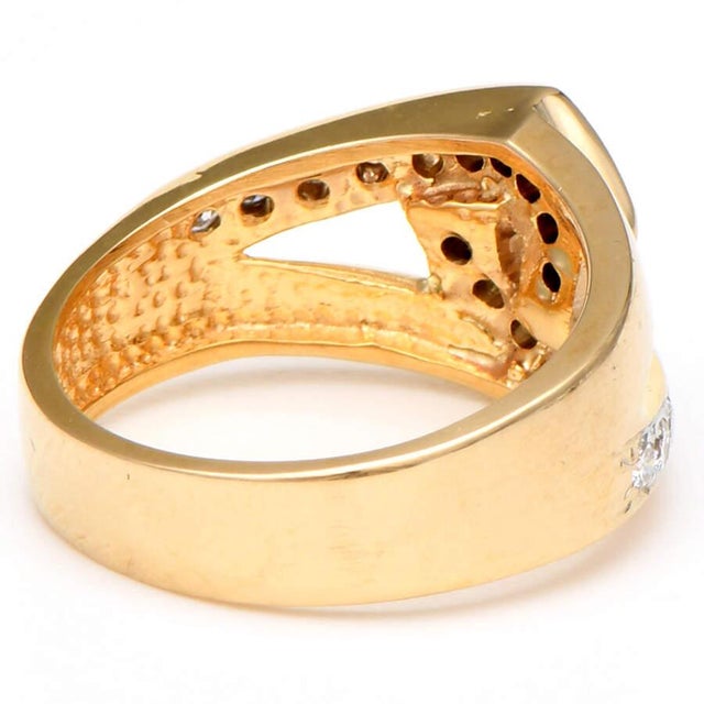 Dazzling diamonds interlock to create a fashionable design in this unique band ring. The stones are radiant and divine and...