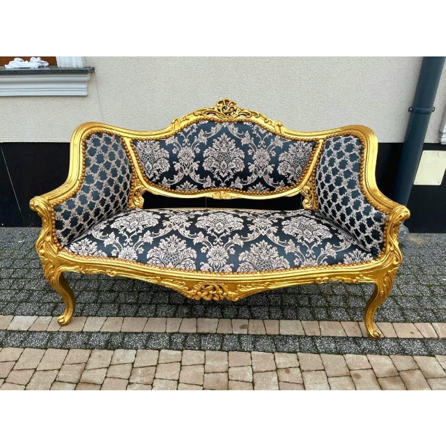 This vintage French Baroque style tufted settee is a dramatic statement piece designed to bring richness, romance, and...