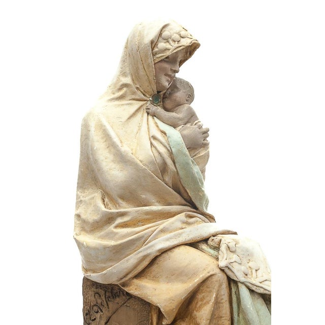 Painted plaster statue of the Virgin and Child by Adelaïde Maeterlinck-Lefebvre (1860-1940) Signed and stamped "AML". This...