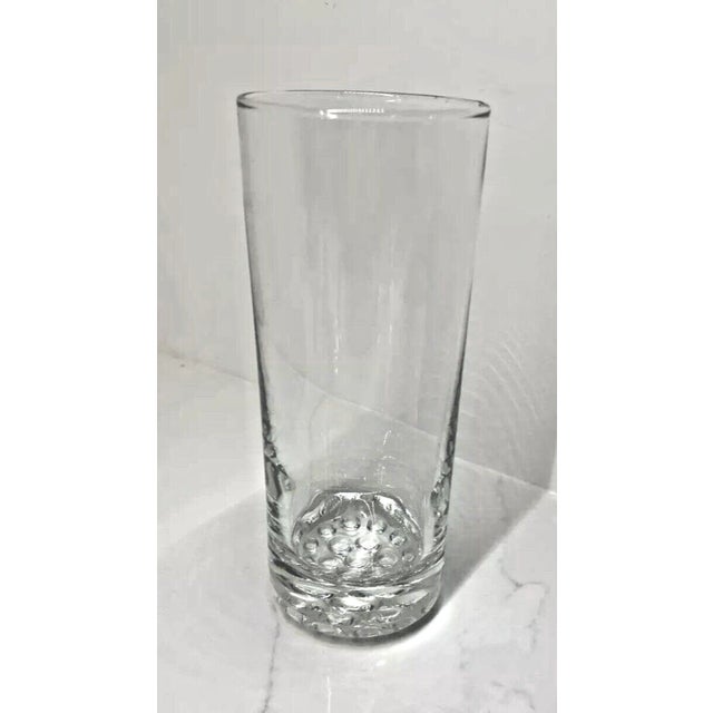 Six vintage clear glass tumblers featuring distinctive hobnail textured bottoms. Each glass stands 6 inches tall with a...