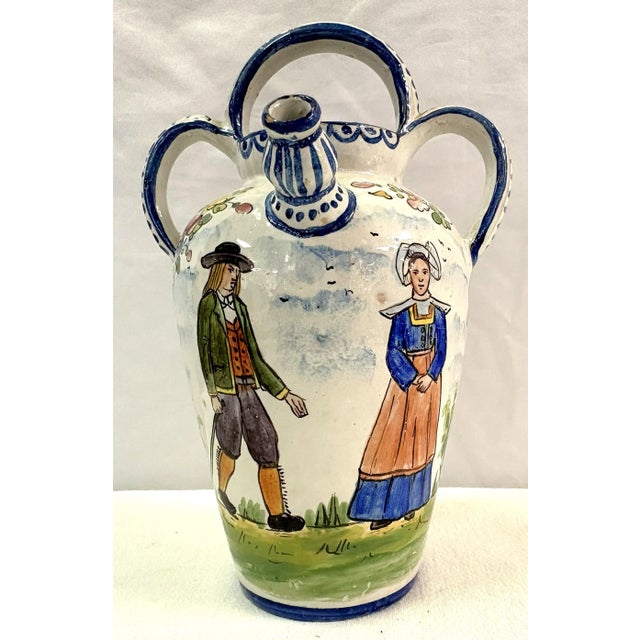 Sweet vintage French hand painted pottery teapot. The French piece is made in the faïence technique with a fine white tin-...