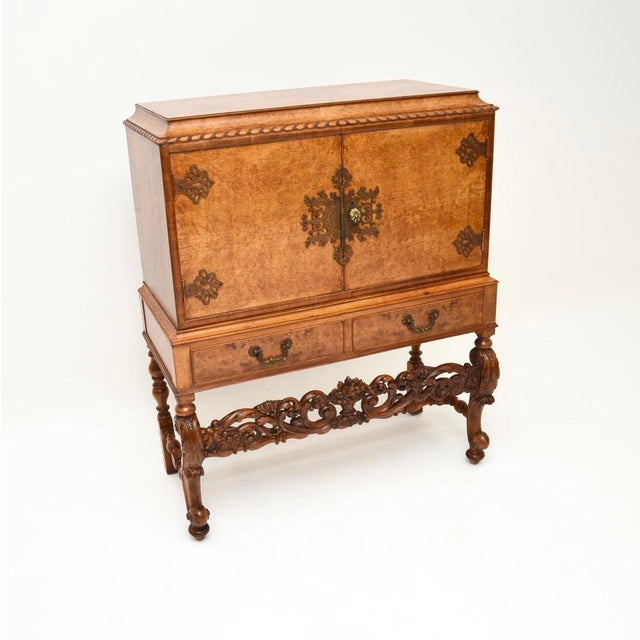 A superb antique burr walnut cocktail drinks cabinet, dating from around the 1920’s period. The quality is outstanding,...