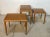 This high-quality set of three nesting tables was manufactured in Denmark during the 1960s. It is made from solid oak wood...