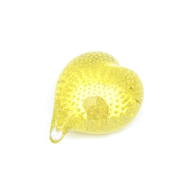 This sensual vintage Murano hand blown yellow bullicante or bubble glass paperweight has the original label from the 60's...