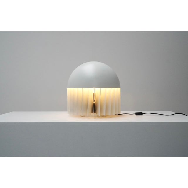 MT table lamp designed by Giancarlo Mattioli for Sirrah, Italy, 1969. Rather than exposing the bulb directly, Mattioli...
