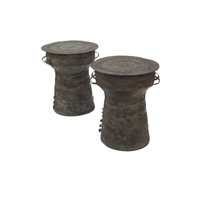 A cast bronze rain drum handcrafted by master artisans on the island of Java, showcasing intricate surface detailing and a...