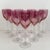 1960s pink wine glasses on transparent baluster stems with flower petal decoration where stem meets bowl. Mold-made. The...